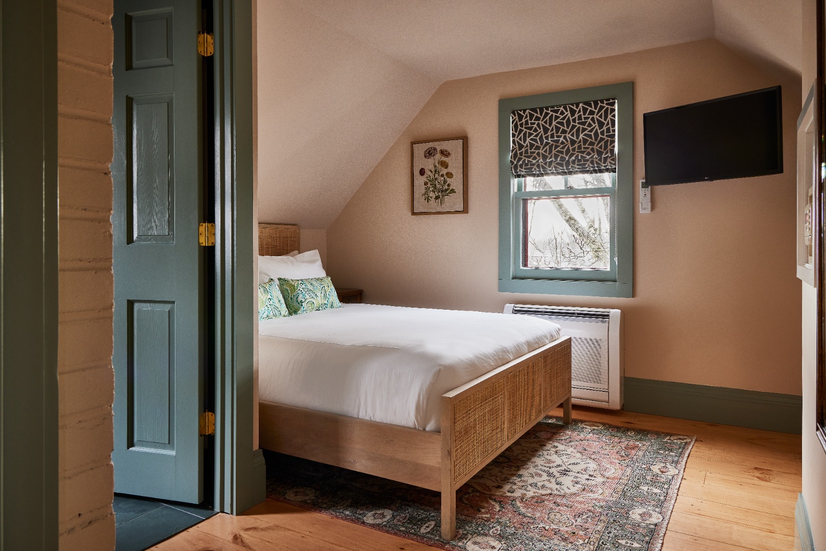 10 A Cliff Road Nantucket, MA 02554 - Photo 14 of 16 a bedroom with a bed and a window