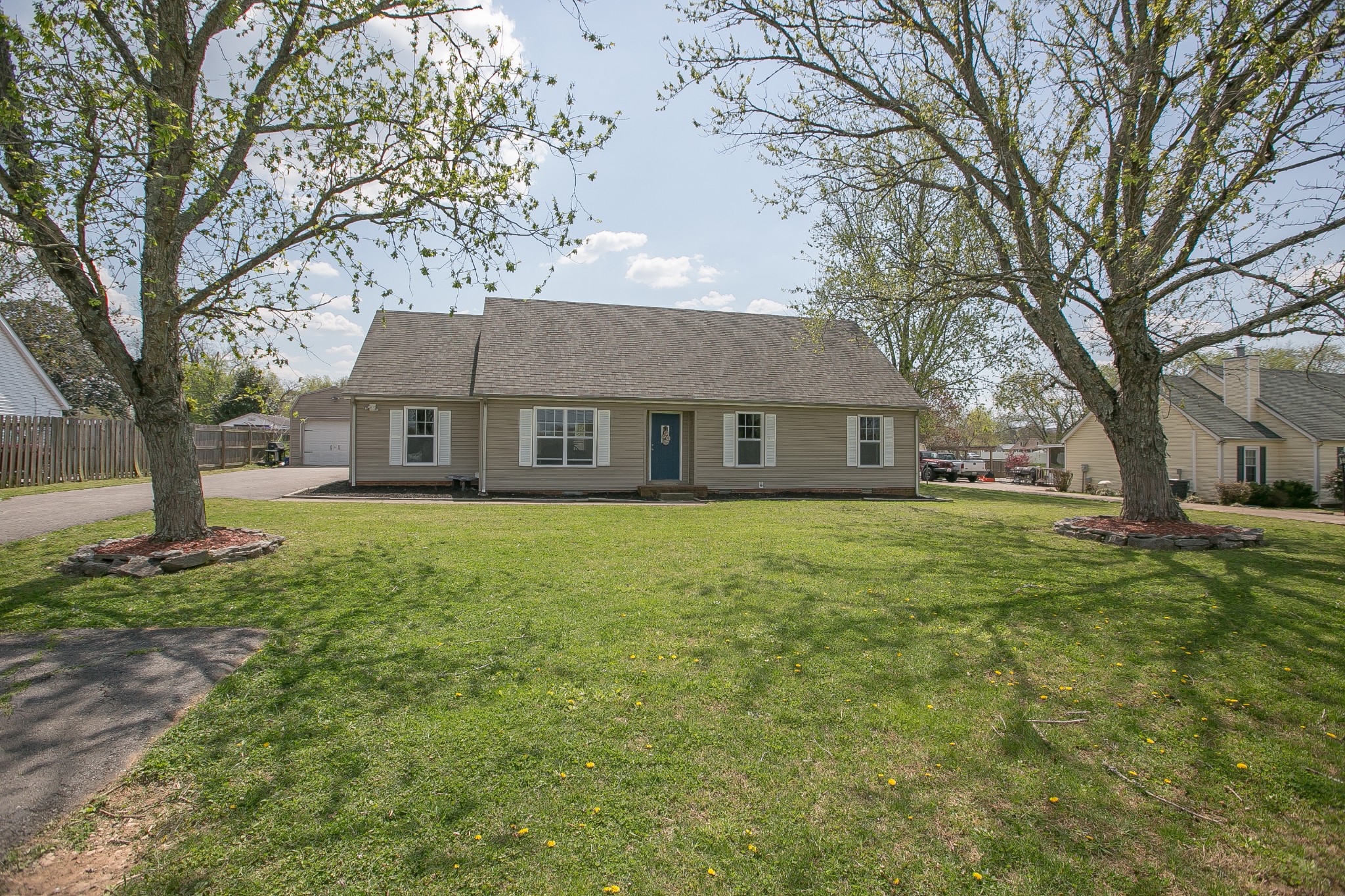 a front view of a house with a garden