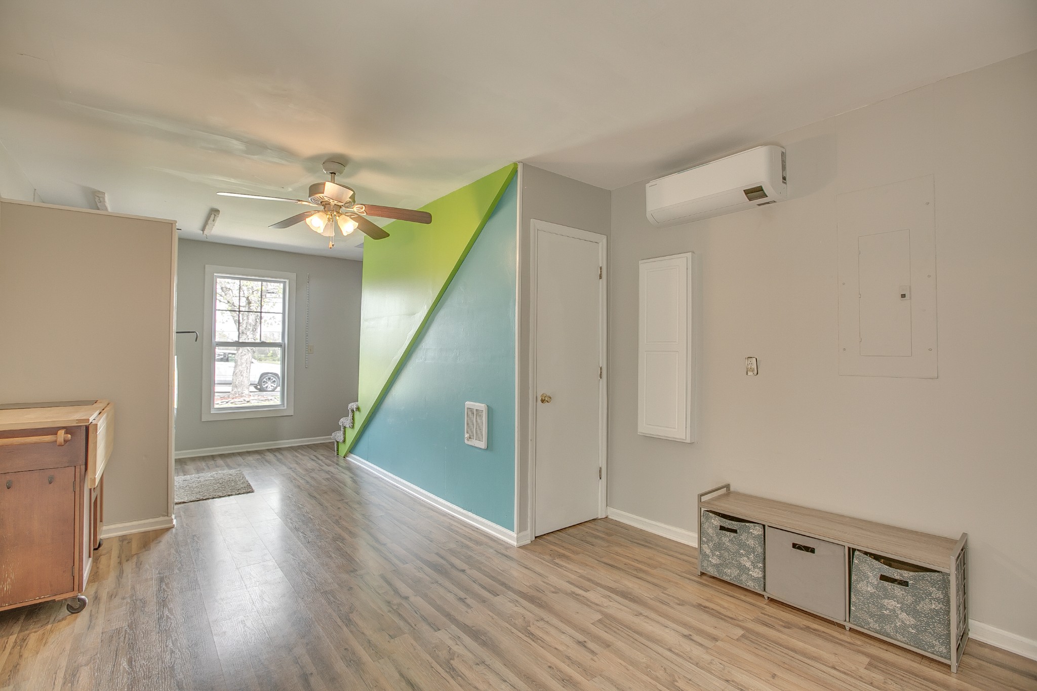 7953 Franklin Road Murfreesboro, TN 37128 - Photo 16 of 26 a view of a livingroom with wooden floor and stairs