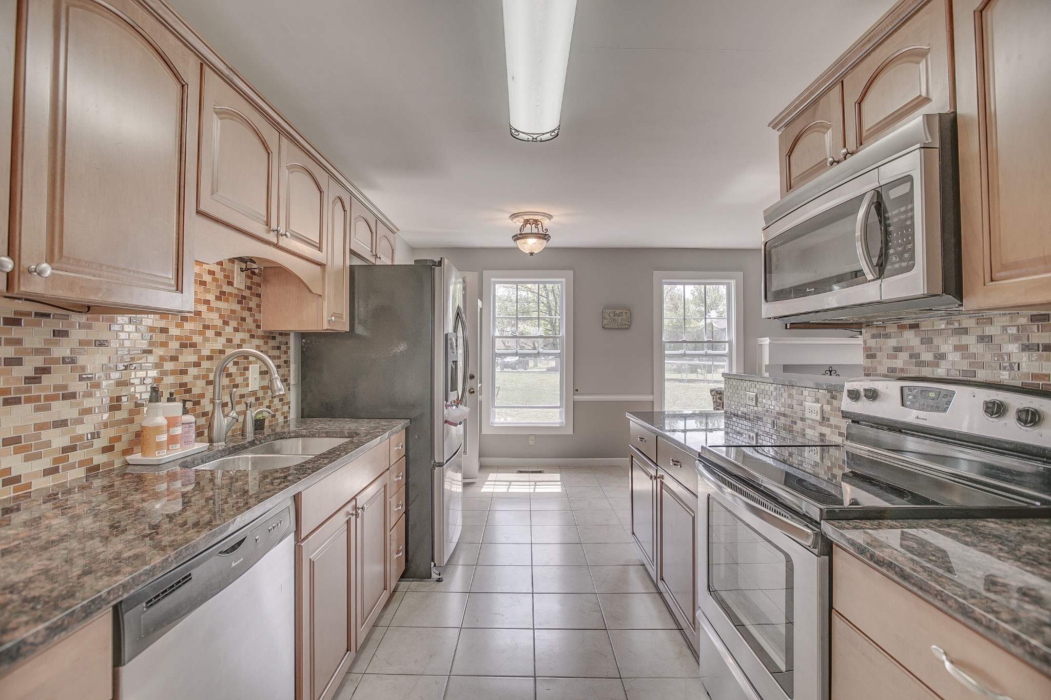 7953 Franklin Road Murfreesboro, TN 37128 - Photo 5 of 26 a kitchen with stainless steel appliances granite countertop a sink stove and refrigerator