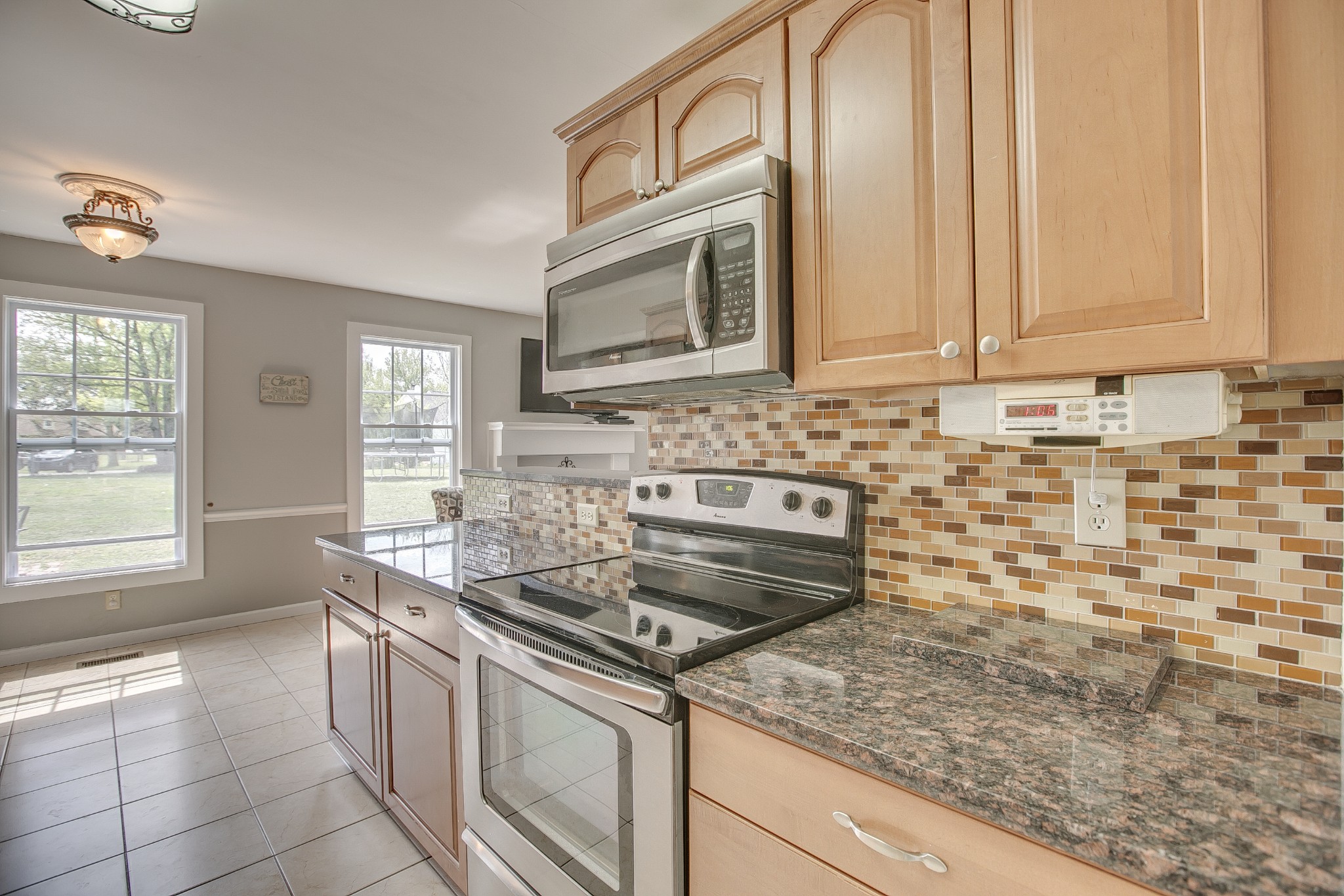 7953 Franklin Road Murfreesboro, TN 37128 - Photo 7 of 26 a kitchen with stainless steel appliances granite countertop a sink stove and cabinets