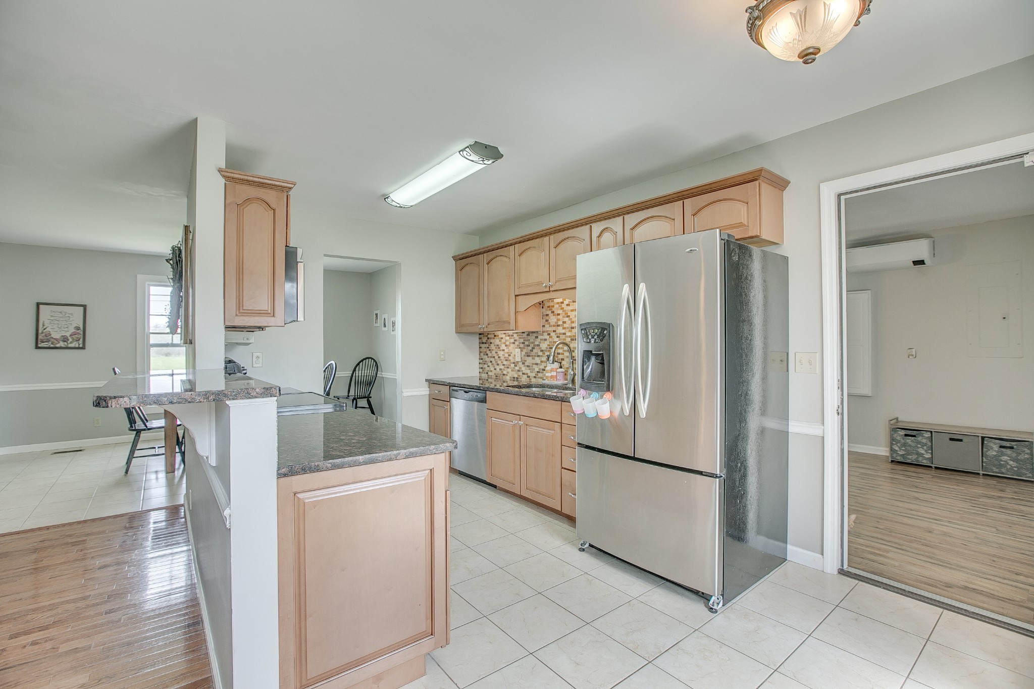 7953 Franklin Road Murfreesboro, TN 37128 - Photo 8 of 26 a kitchen with white cabinets and stainless steel appliances
