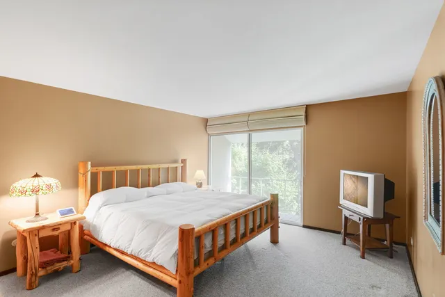 a bathroom with a double vanity sink mirror and shower
