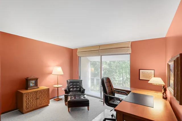 a bathroom with a double vanity sink toilet and a mirror
