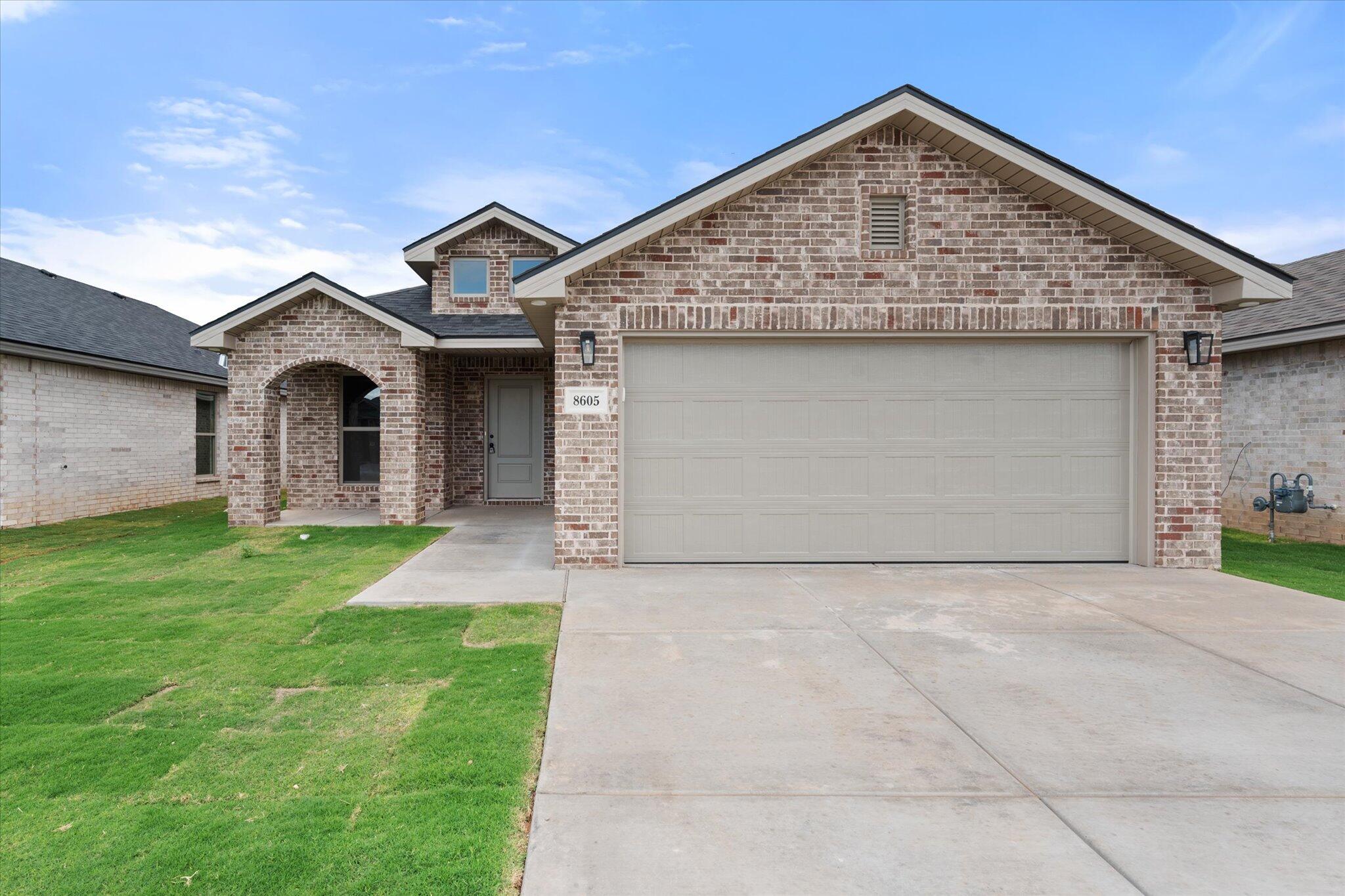 a front view of a house with yard