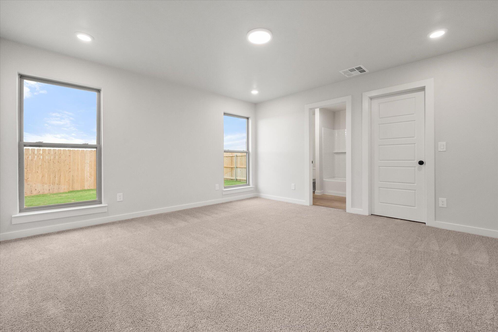 8605 29th Street Lubbock, TX 79407 - Photo 13 of 21 an empty room with windows and closet