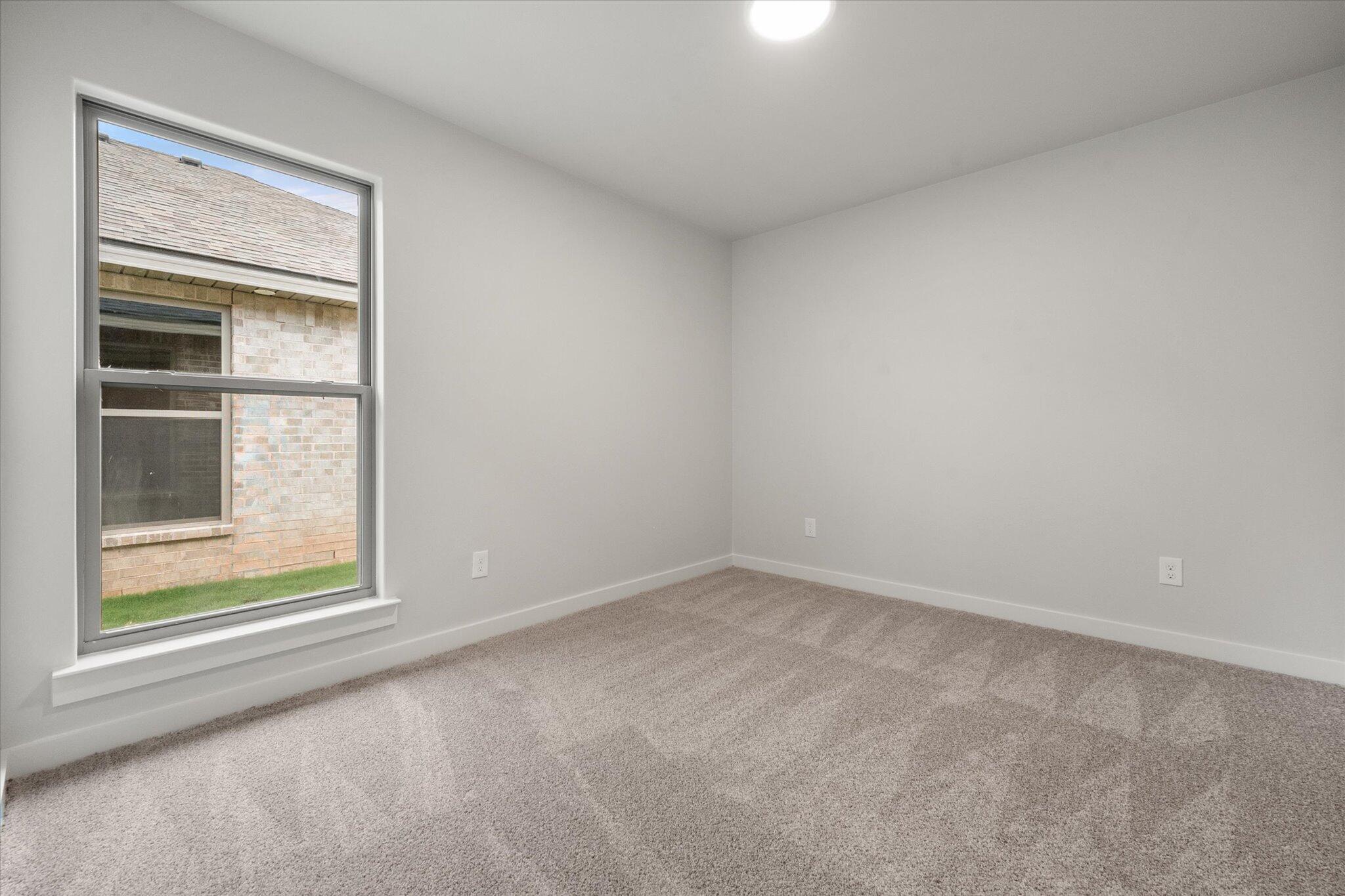 8605 29th Street Lubbock, TX 79407 - Photo 16 of 21 an empty room with a window