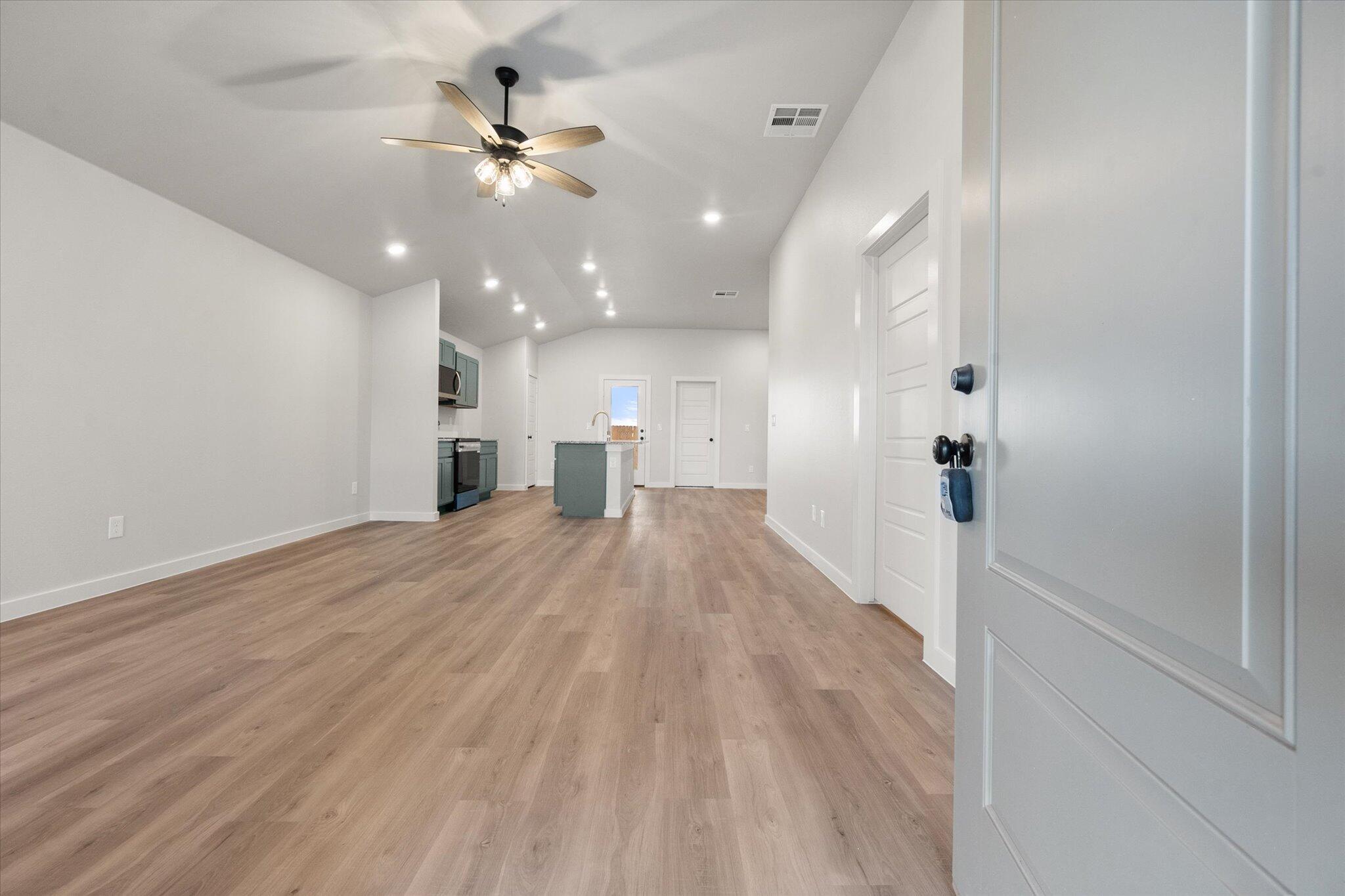 8605 29th Street Lubbock, TX 79407 - Photo 2 of 21 a view of a hallway with a kitchen