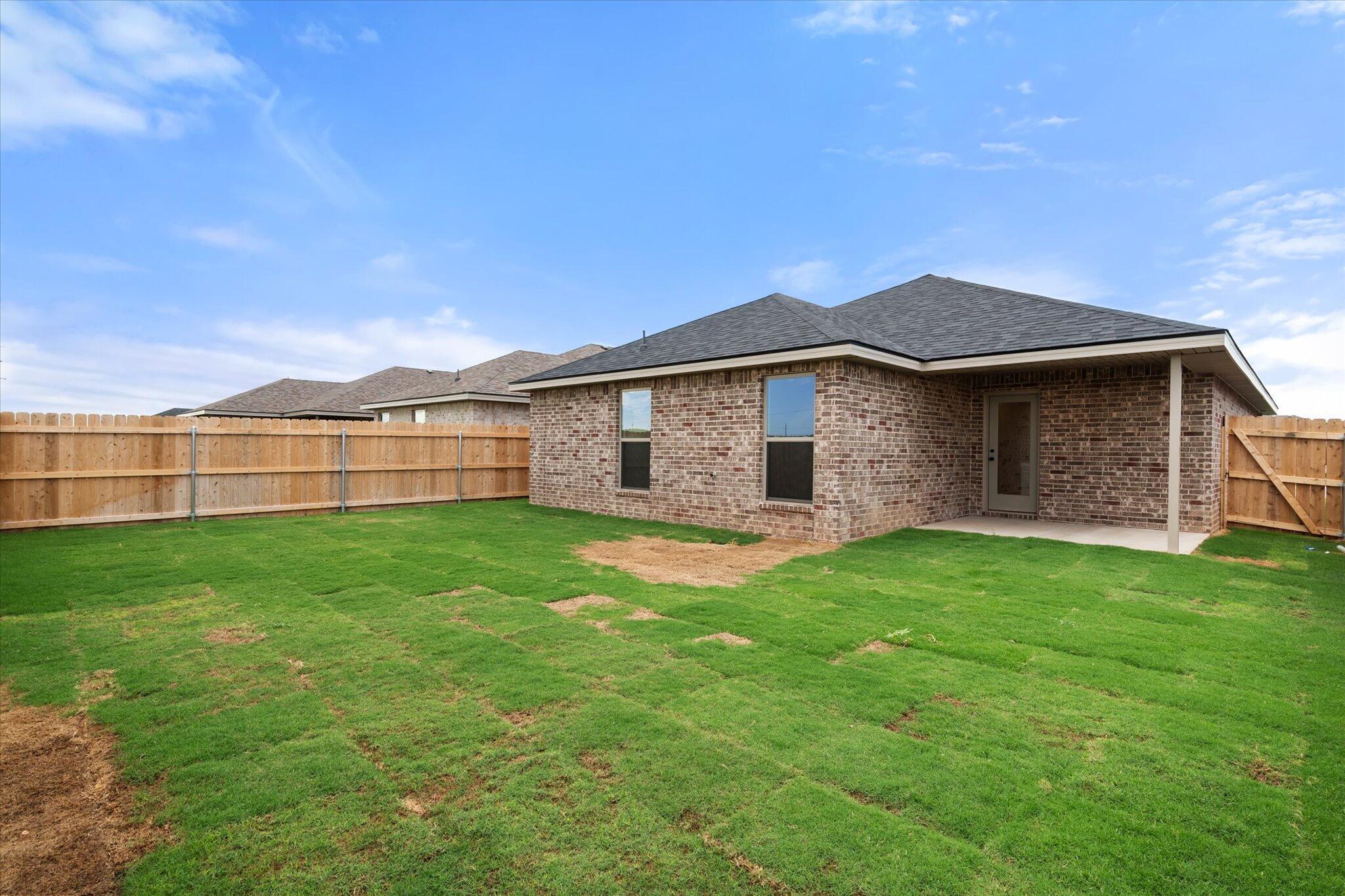 8605 29th Street Lubbock, TX 79407 - Photo 21 of 21 a view of a yard with a house
