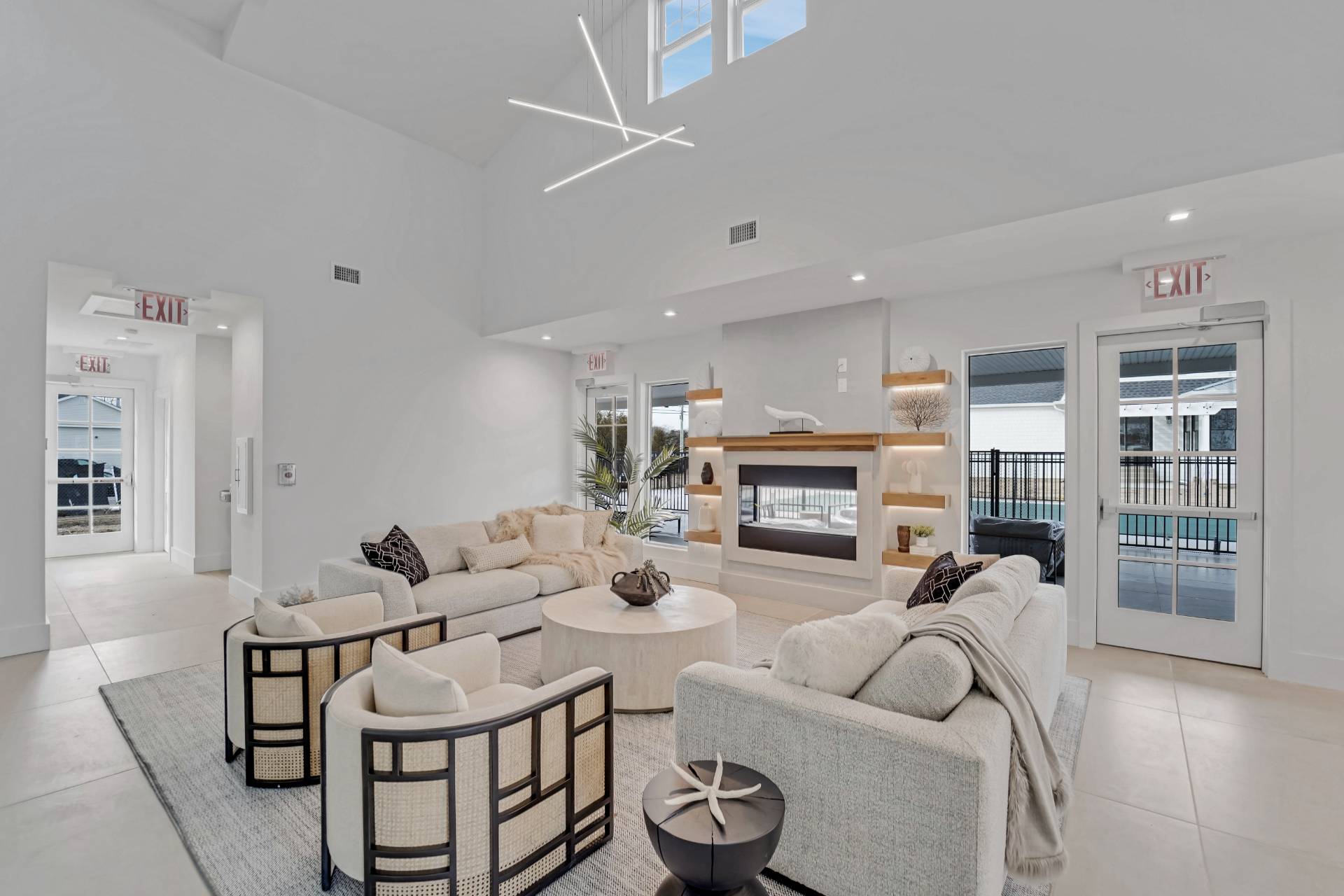 12 Depot Road, Unit 1102 Westhampton Beach, NY 11978 - Photo 3 of 20 a living room with furniture and a fireplace