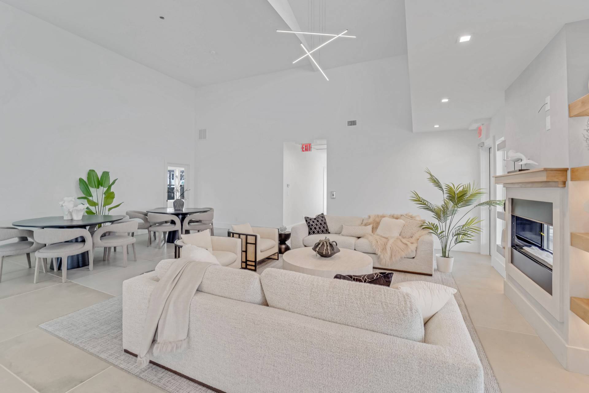 12 Depot Road, Unit 1102 Westhampton Beach, NY 11978 - Photo 8 of 20 a living room with furniture fireplace and a fireplace