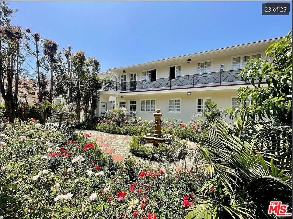 1212 10th Street, Unit 2 Santa Monica, CA 90401 - Photo 28 of 29 a view of a patio with table and chairs and potted plants