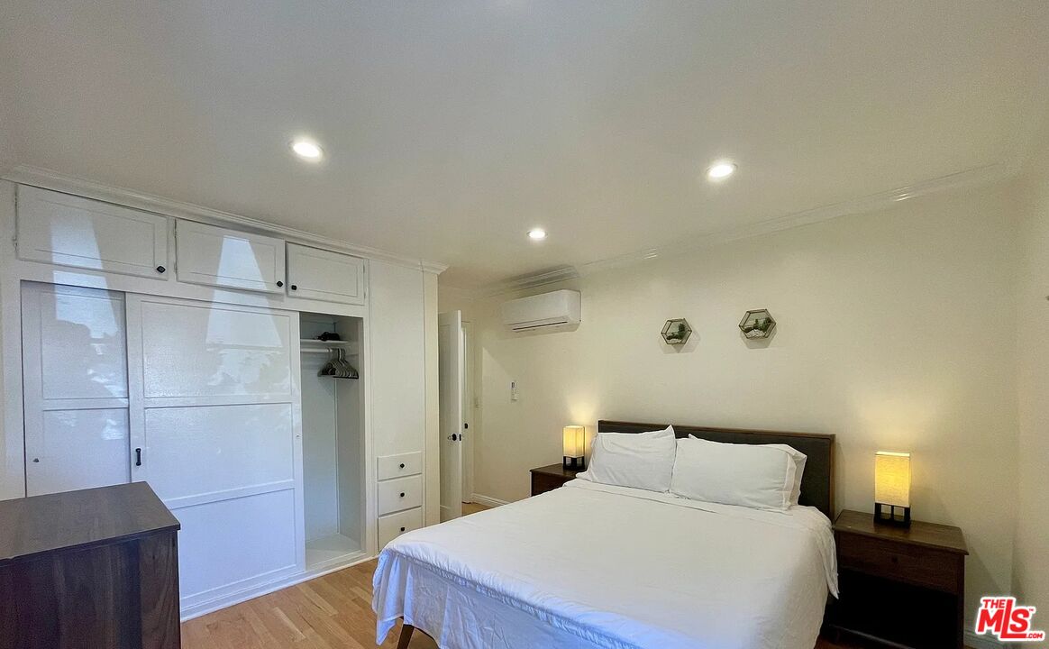 1212 10th Street, Unit 2 Santa Monica, CA 90401 - Photo 8 of 29 a bedroom with a bed and a walk in closet