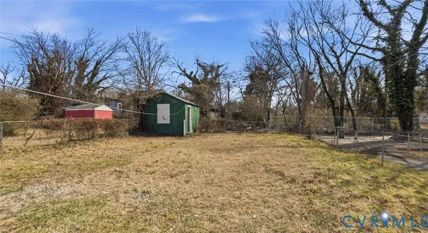 a backyard of a house with trees