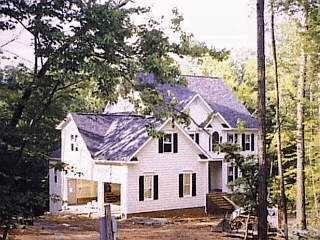 2724 Sunnystone Way Raleigh, NC 27613 - Photo 1 of 1 a view of a white house next to a road with a tree