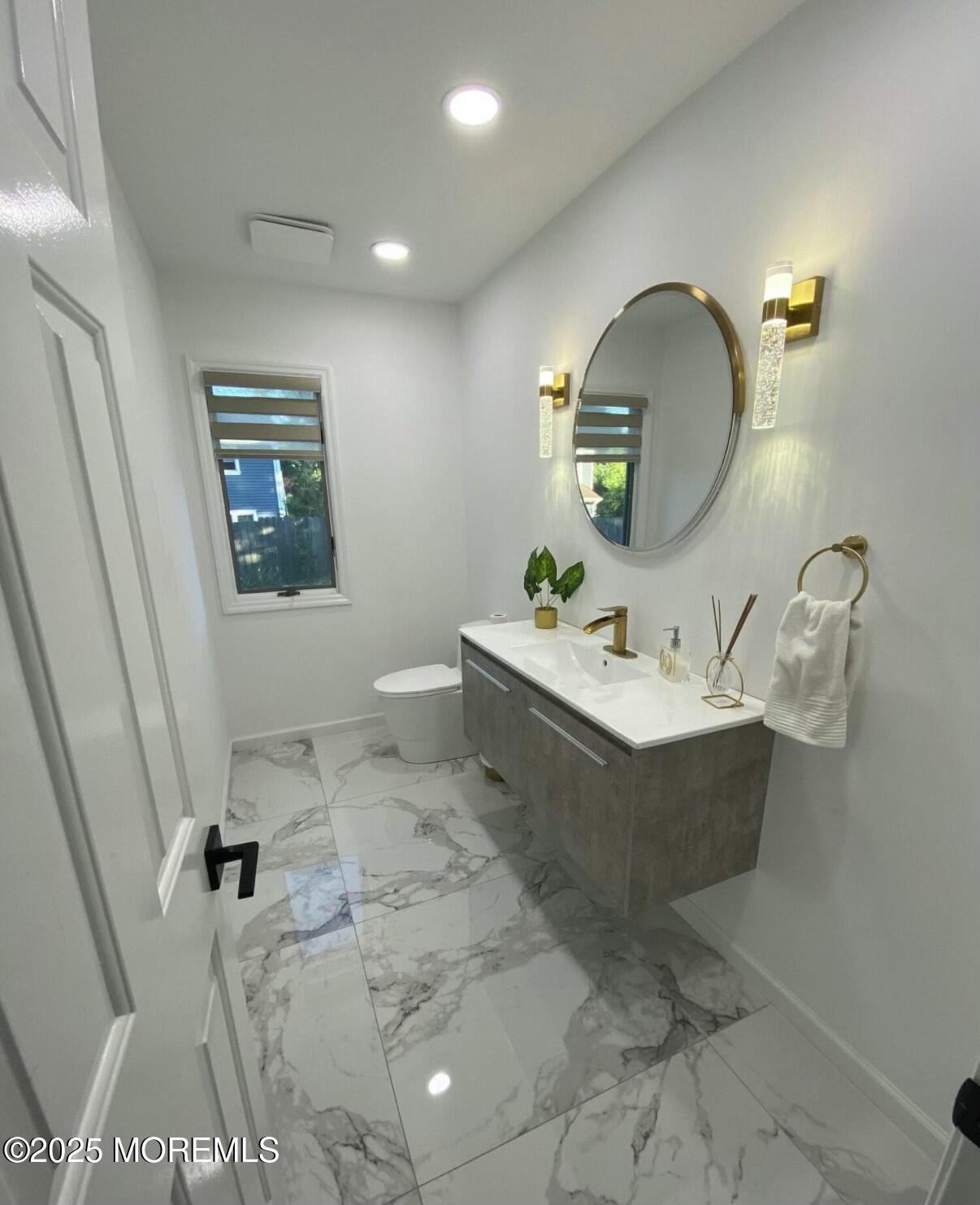 604 Van Note Parkway Oakhurst, NJ 07755 - Photo 12 of 19 a bathroom with a sink vanity and mirror