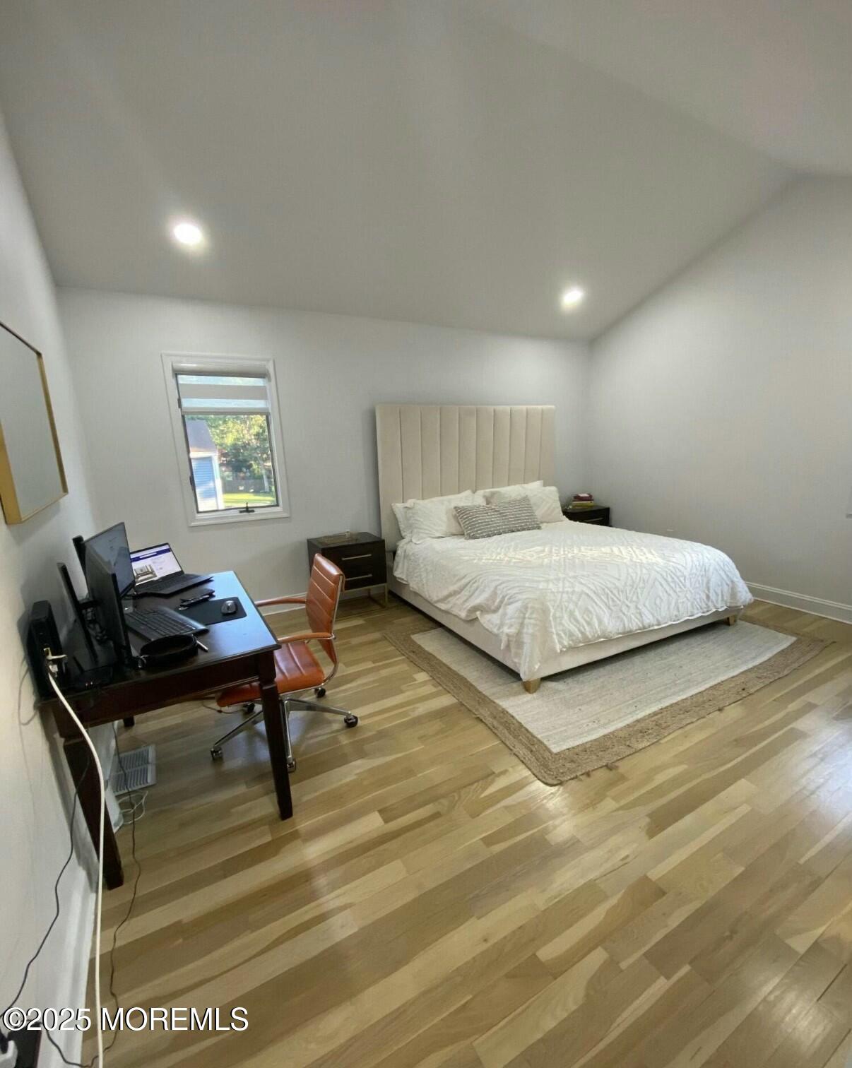 604 Van Note Parkway Oakhurst, NJ 07755 - Photo 14 of 19 a bedroom with a bed and wooden floor