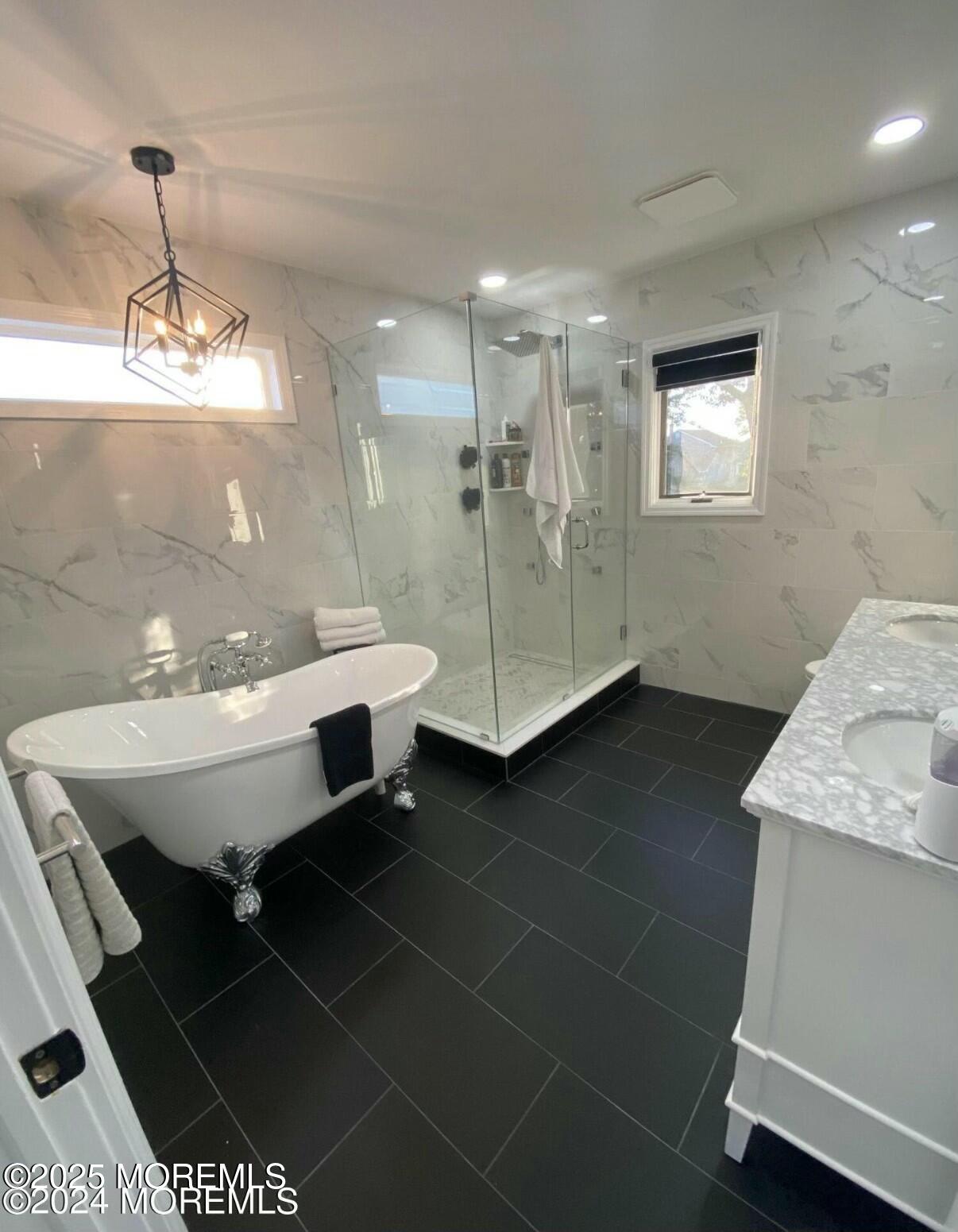 604 Van Note Parkway Oakhurst, NJ 07755 - Photo 16 of 19 a bathroom with a sink and a mirror