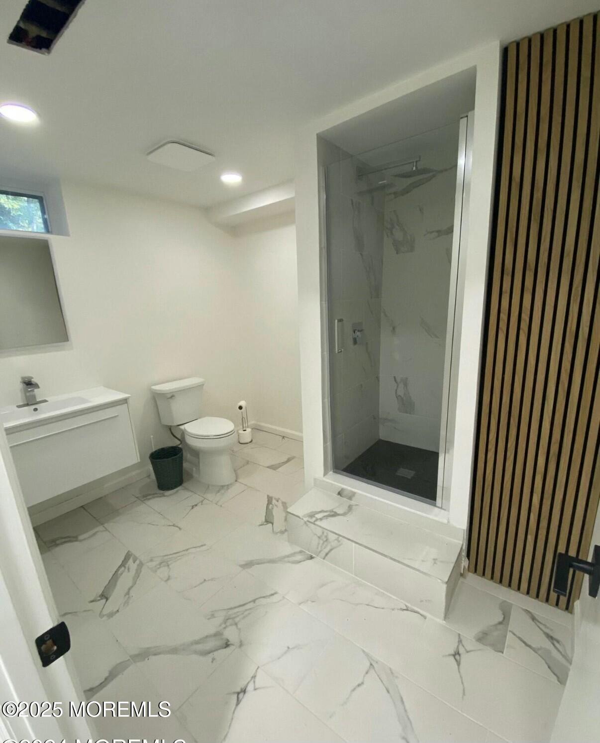 604 Van Note Parkway Oakhurst, NJ 07755 - Photo 18 of 19 a bathroom with a sink toilet and shower