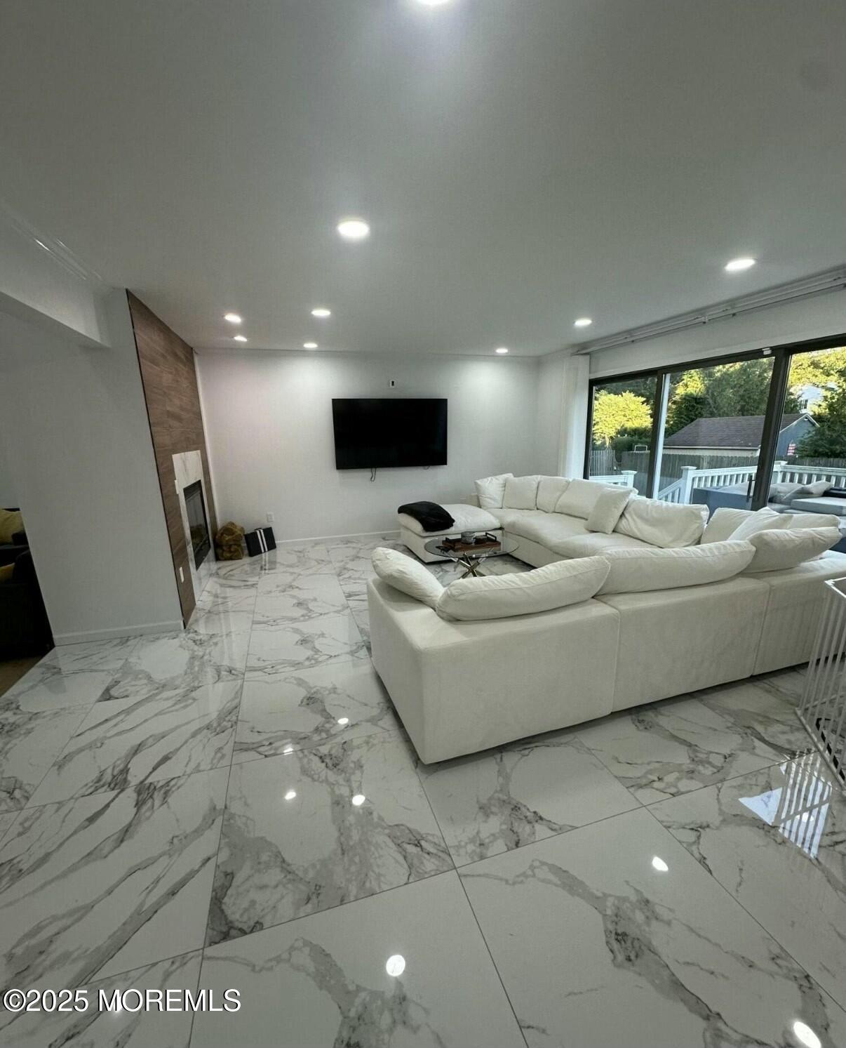 604 Van Note Parkway Oakhurst, NJ 07755 - Photo 4 of 19 a living room with furniture and a flat screen tv