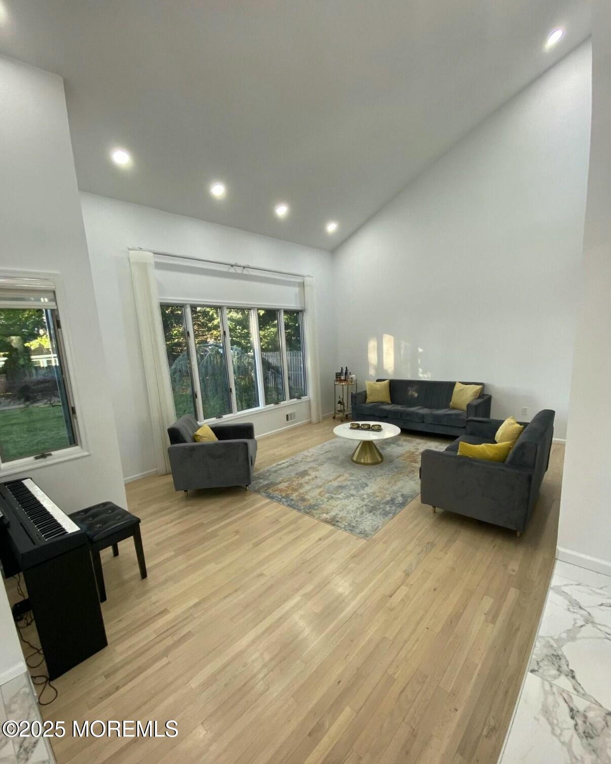 604 Van Note Parkway Oakhurst, NJ 07755 - Photo 9 of 19 a living room with furniture and large window