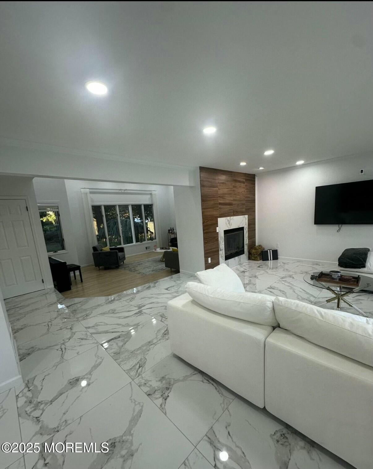 604 Van Note Parkway Oakhurst, NJ 07755 - Photo 10 of 19 a living room with furniture and a fireplace