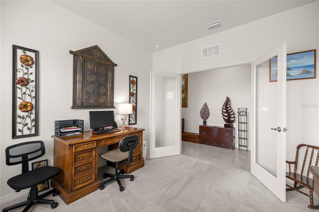 6125 Southwest 88th Loop Ocala, FL 34476 - Photo 15 of 29 a view of a workspace with furniture and a window
