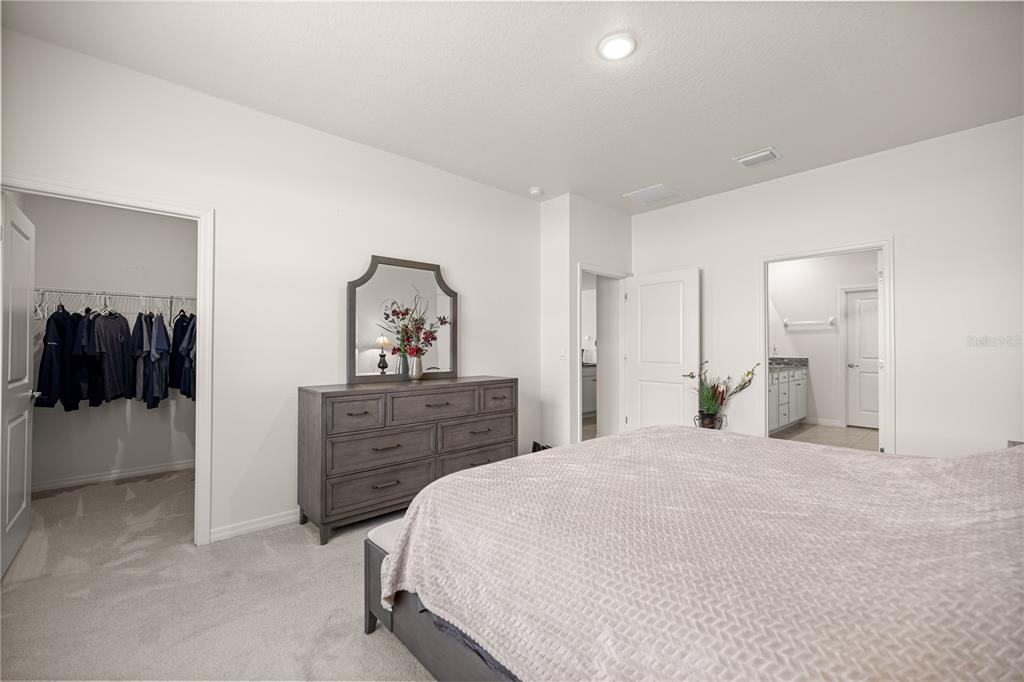 6125 Southwest 88th Loop Ocala, FL 34476 - Photo 20 of 29 a bedroom with a bed and a dresser