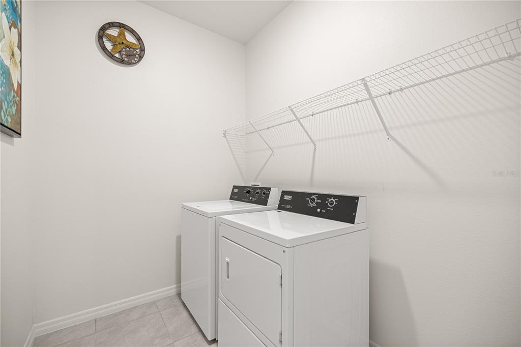 6125 Southwest 88th Loop Ocala, FL 34476 - Photo 23 of 29 a utility room with dryer and washer
