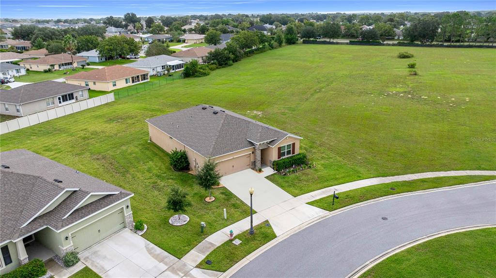 6125 Southwest 88th Loop Ocala, FL 34476 - Photo 4 of 29 an aerial view of a house with a garden