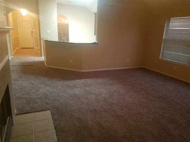 an empty room with closet and bathroom