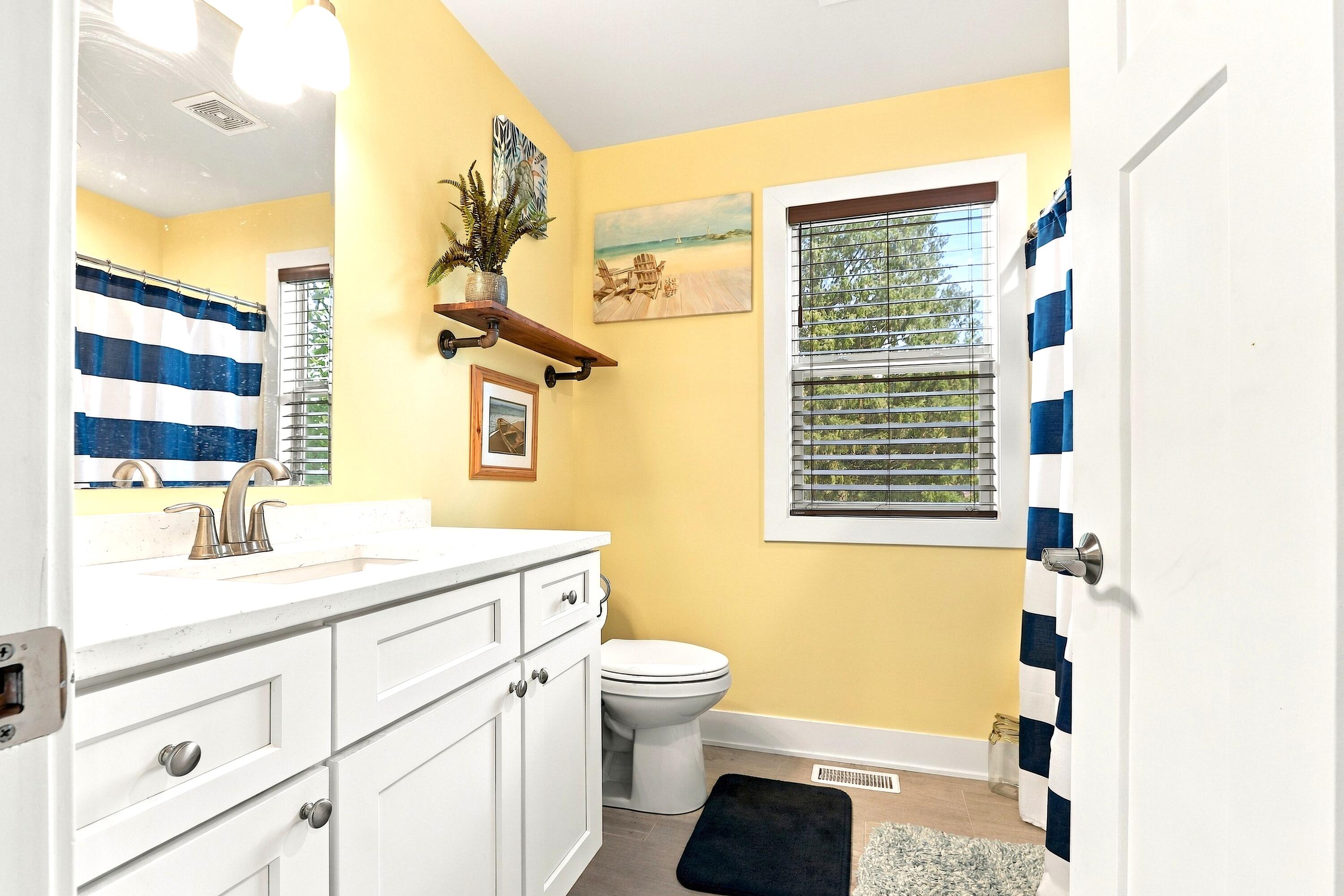 78 Menominee Road Williams Bay, WI 53191 - Photo 23 of 40 The cheerful UL full Bathroom has tile floors, a single sink vanity with quartz top, comfort height toilet and tub/shower.