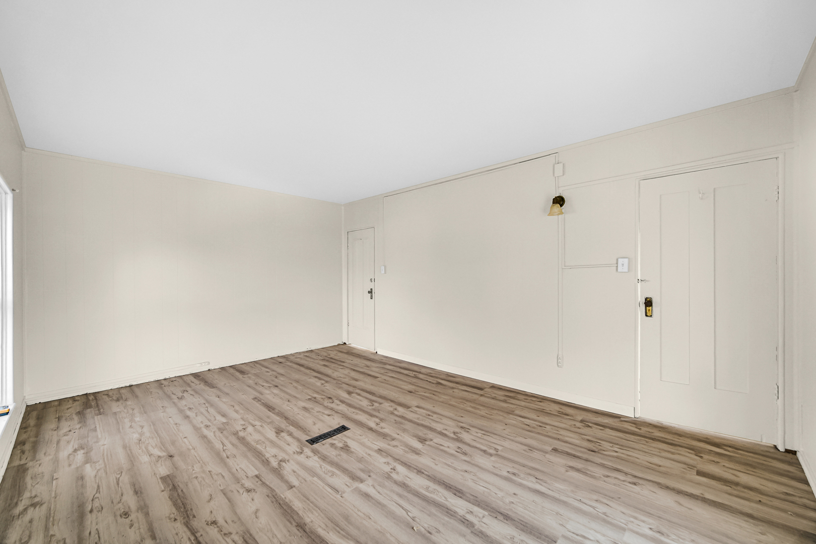 15409 Joliet Road Plainfield, IL 60544 - Photo 12 of 32 a view of an empty room with wooden floor