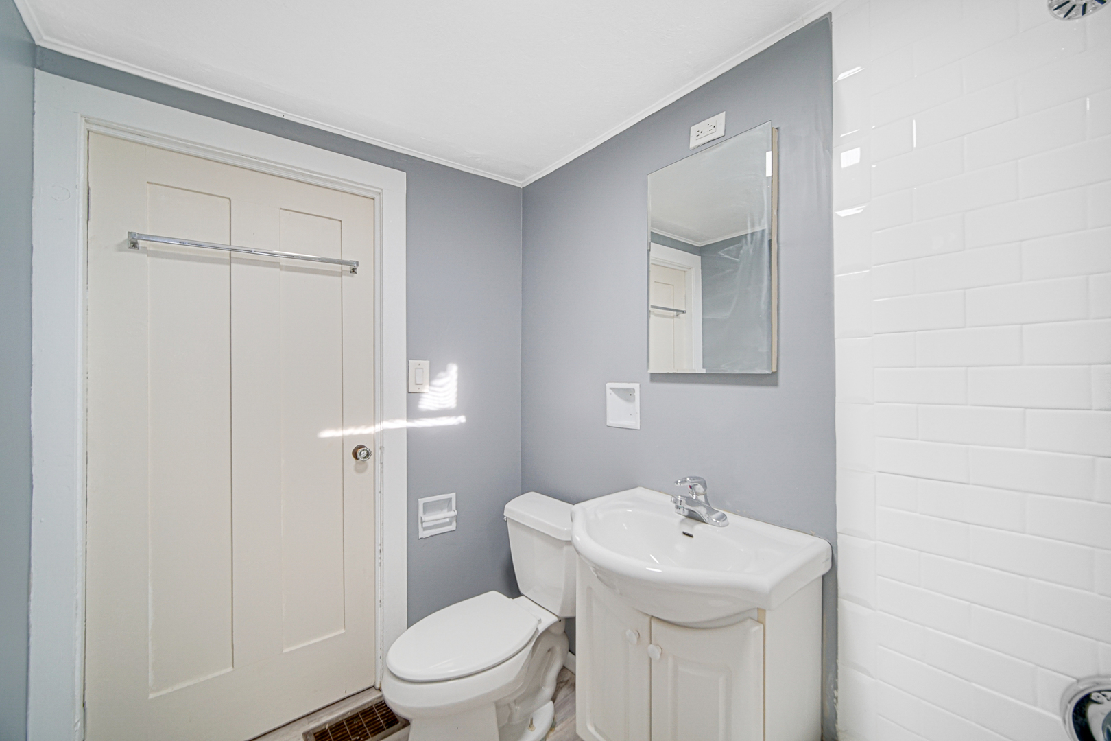 15409 Joliet Road Plainfield, IL 60544 - Photo 17 of 32 a bathroom with a sink a toilet and shower