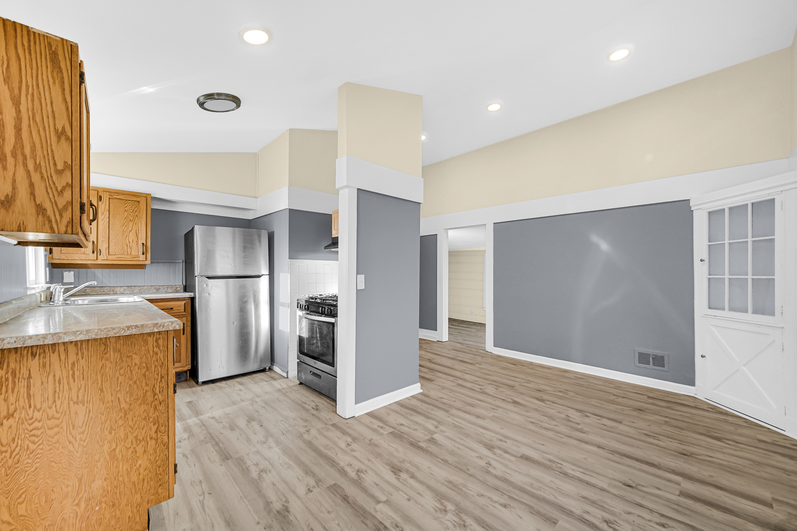15409 Joliet Road Plainfield, IL 60544 - Photo 19 of 32 a view of a kitchen with a sink and a refrigerator