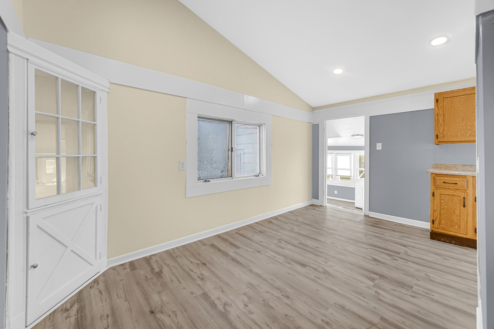 15409 Joliet Road Plainfield, IL 60544 - Photo 21 of 32 a view of an empty room with wooden floor and a window