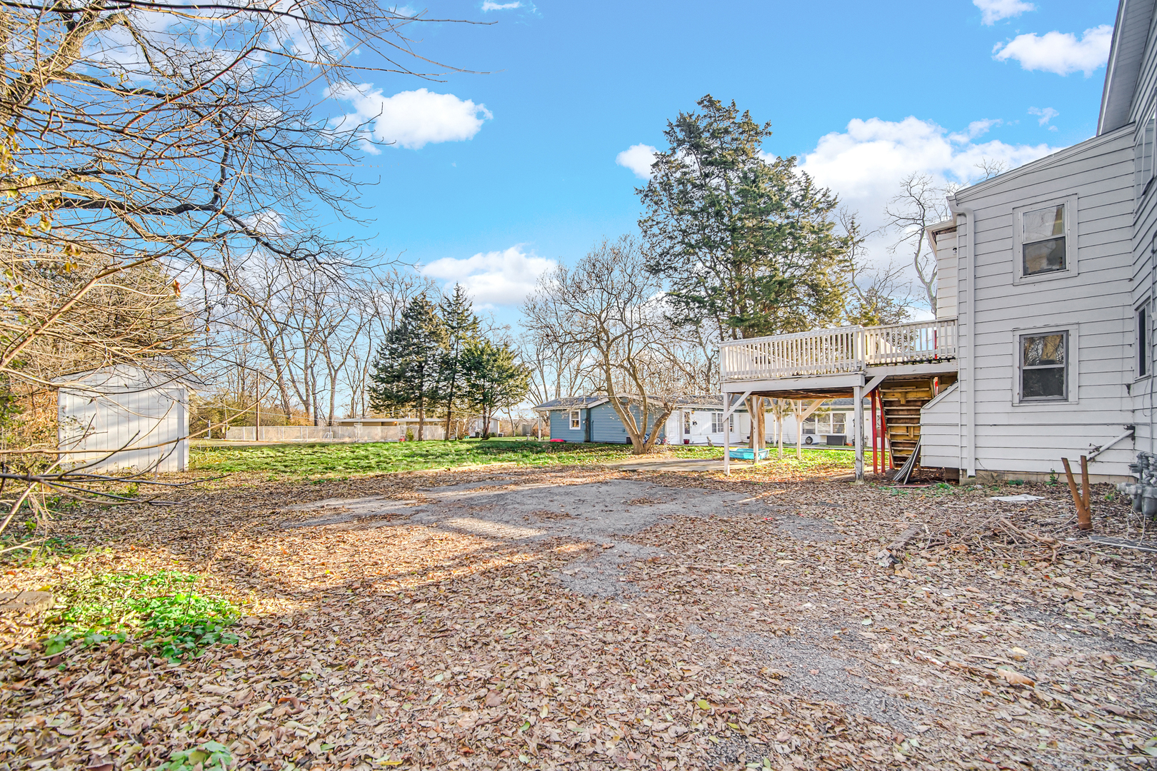 15409 Joliet Road Plainfield, IL 60544 - Photo 29 of 32 a view of a house with a yard and a large tree