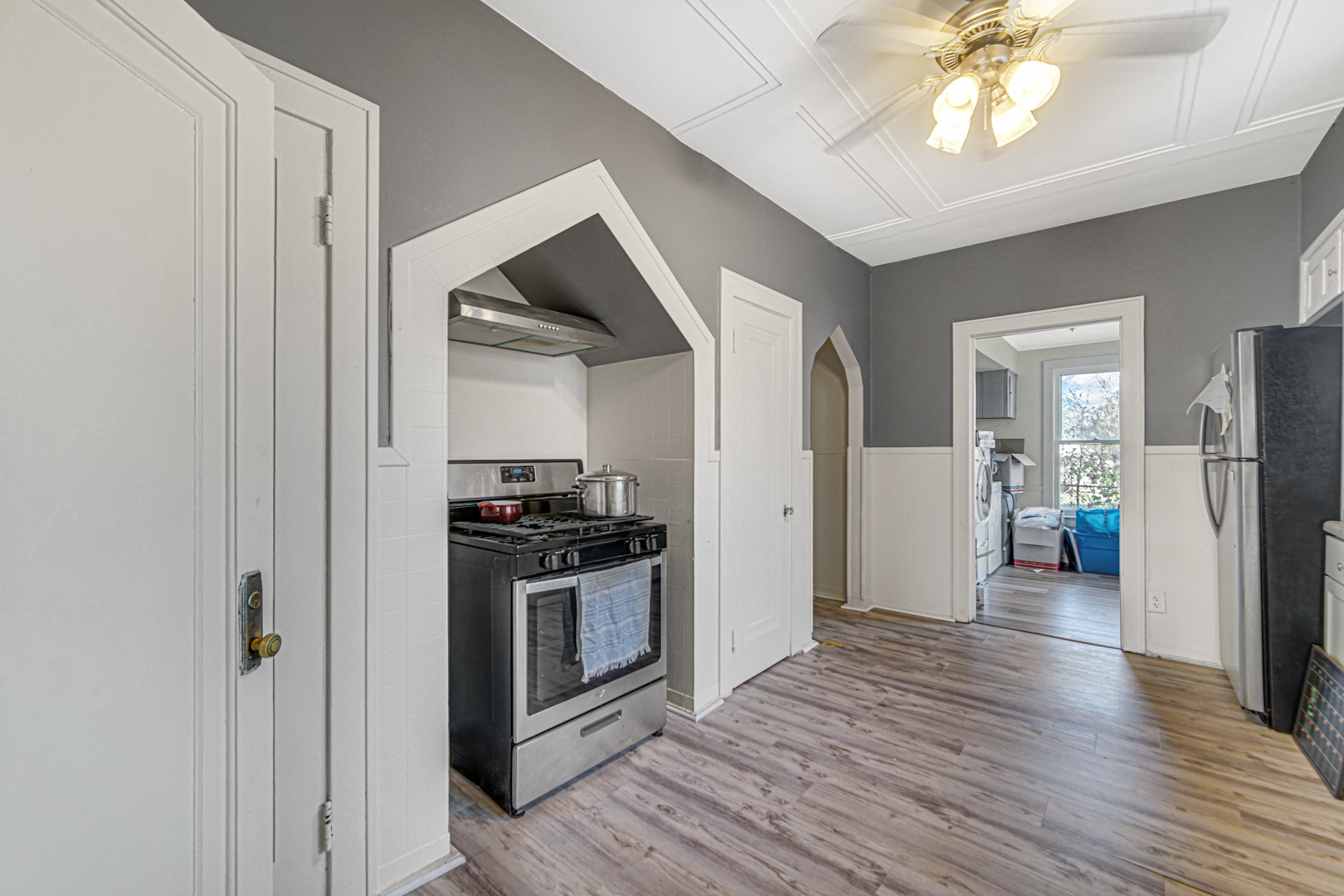 15409 Joliet Road Plainfield, IL 60544 - Photo 7 of 32 a view of a kitchen with a stove cabinets and wooden floor