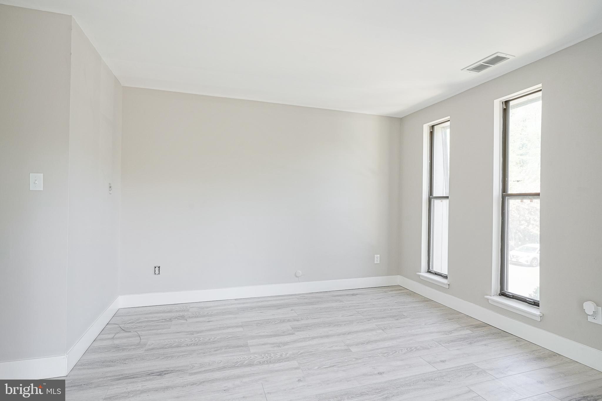 25 South Church Road, Unit 138 Maple Shade, NJ 08052 - Photo 11 of 23 a view of an empty room with wooden floor and a window