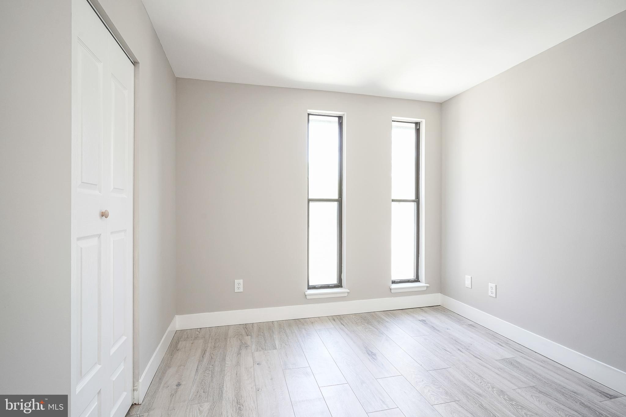 25 South Church Road, Unit 138 Maple Shade, NJ 08052 - Photo 12 of 23 an empty room with wooden floor and window
