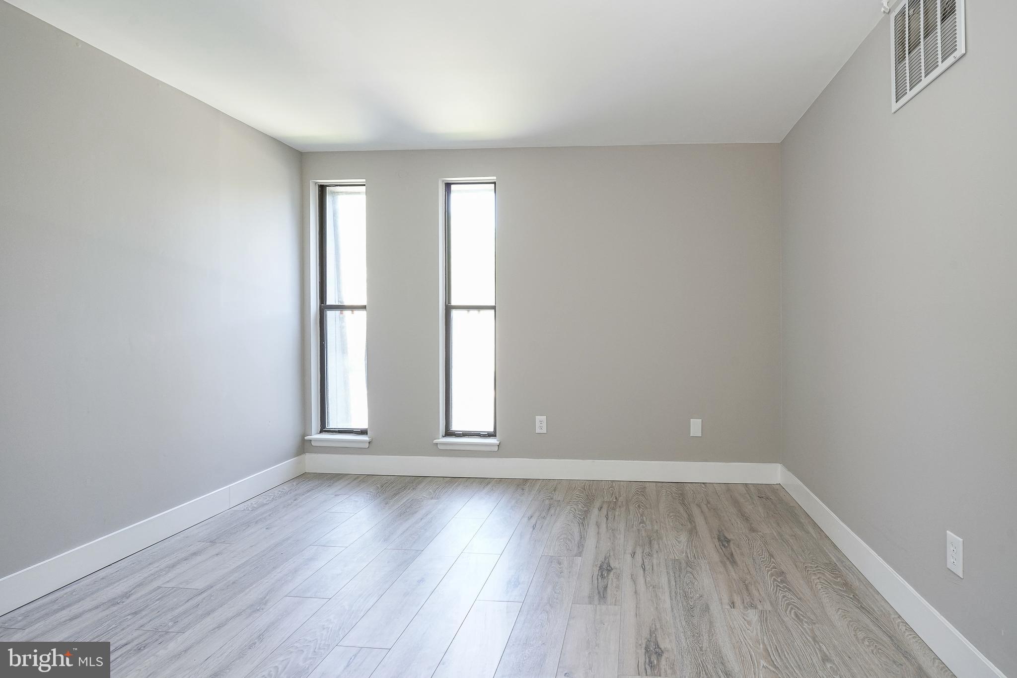 25 South Church Road, Unit 138 Maple Shade, NJ 08052 - Photo 13 of 23 wooden floor in an empty room with a window