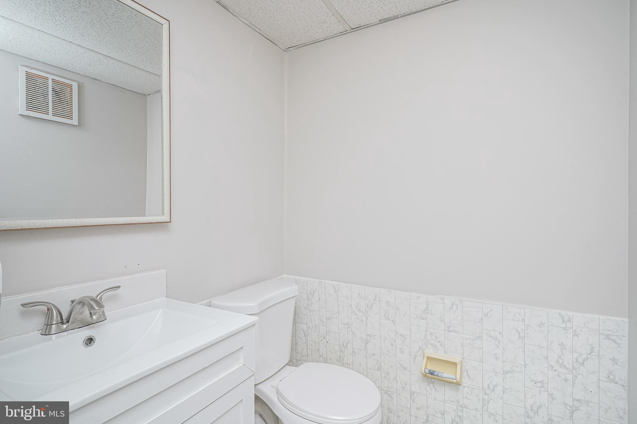 25 South Church Road, Unit 138 Maple Shade, NJ 08052 - Photo 17 of 23 a bathroom with a sink toilet and vanity