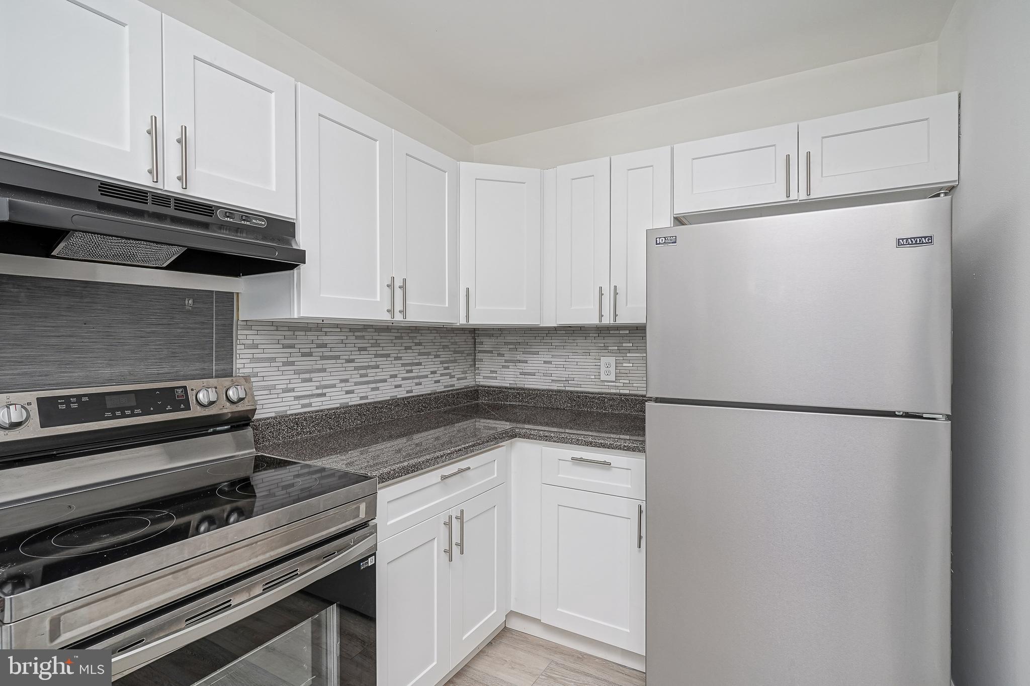 25 South Church Road, Unit 138 Maple Shade, NJ 08052 - Photo 9 of 23 a white refrigerator freezer sitting in a kitchen