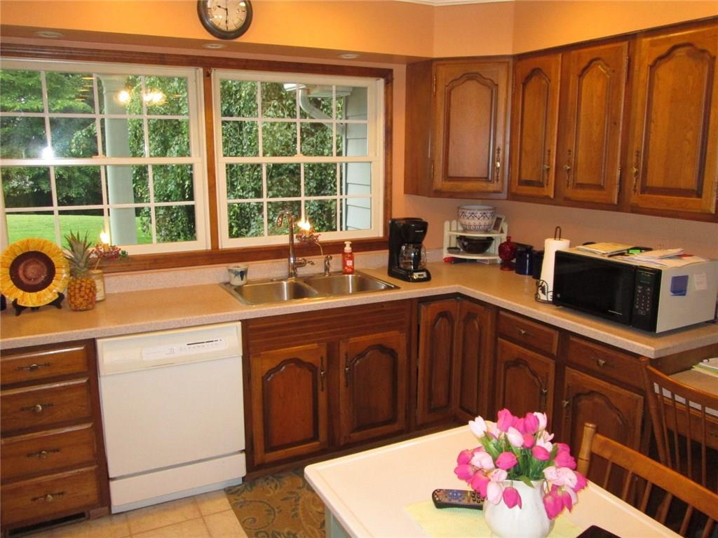 766 Butler Road Kittanning, PA 16201 - Photo 11 of 21 Beautiful 27x12 maple kitchen with Corian counter tops and under cabinet lighting.