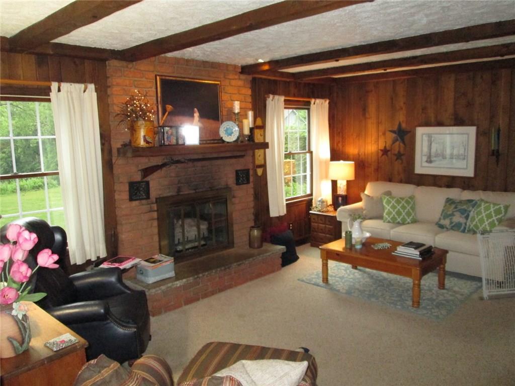766 Butler Road Kittanning, PA 16201 - Photo 13 of 21 First floor family room is 18x13 with fireplace, window looking out over the beautiful rear yard.