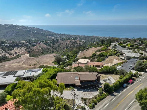 an aerial view of a house with a garden