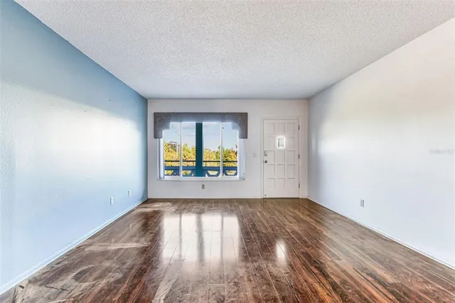 a view of a swimming pool with an outdoor seating and a yard