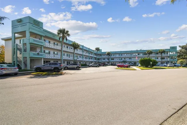 a hallway with windows and brick walls