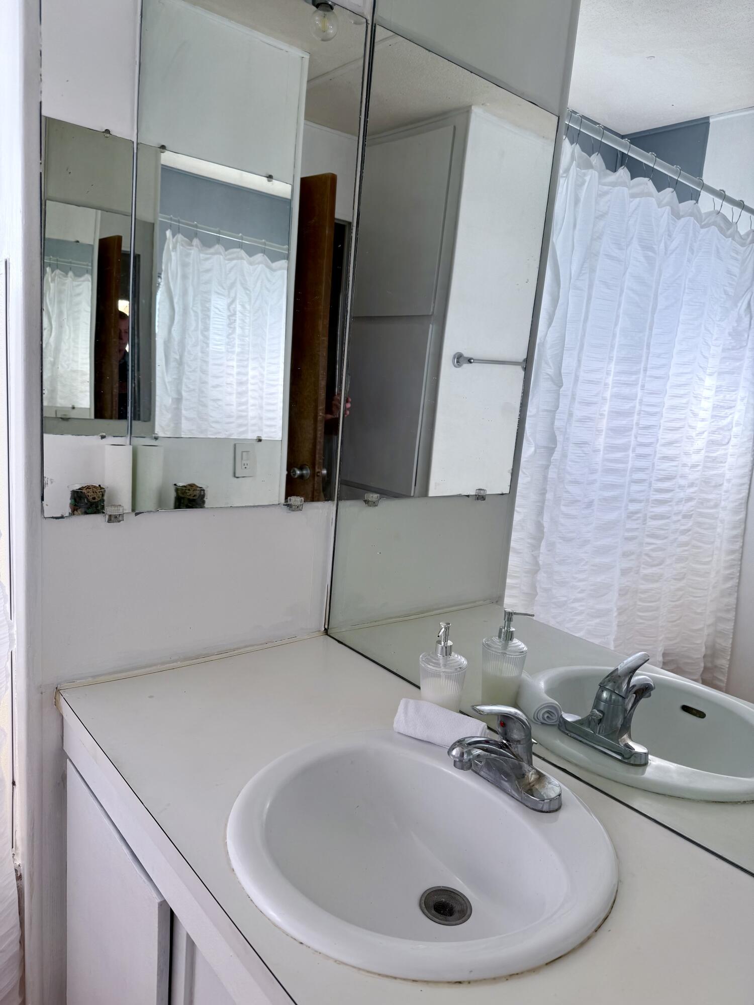 22 Jupiter Street Palm Springs, CA 92264 - Photo 26 of 35 a bathroom with a sink and a mirror