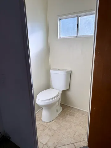 a view of a street with a building in the background